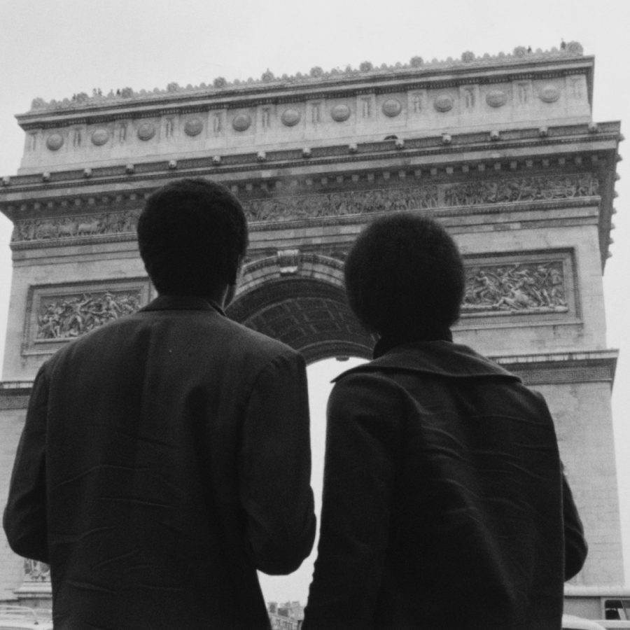 still from the film Nationalité: Immigré. Two black men stand