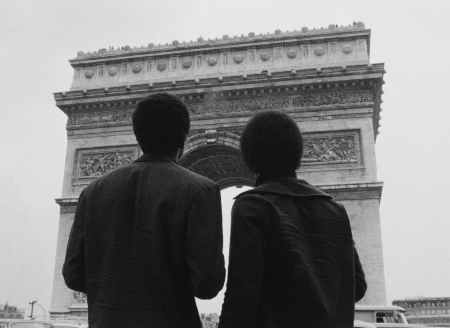 still from the film Nationalité: Immigré. Two black men stand