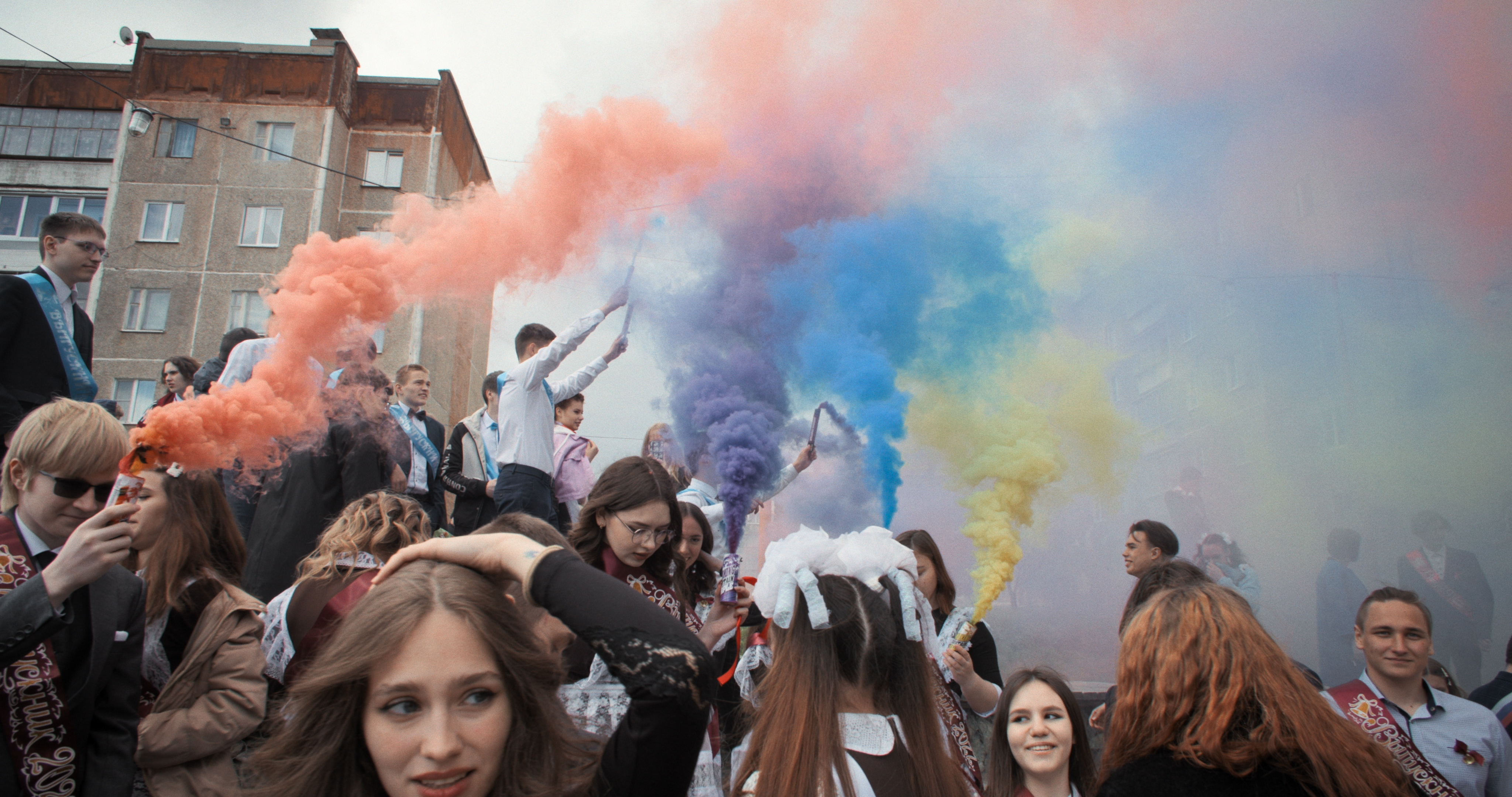 Still from the film Mr Nobody Against Putin. The image shows students protesting with colourful flare smoke in the air.