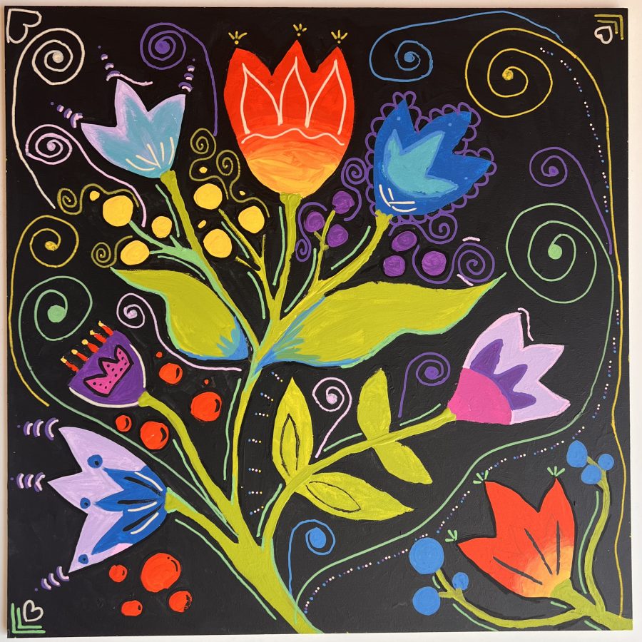 Colourful flowers on a black background to symbolise freedom.