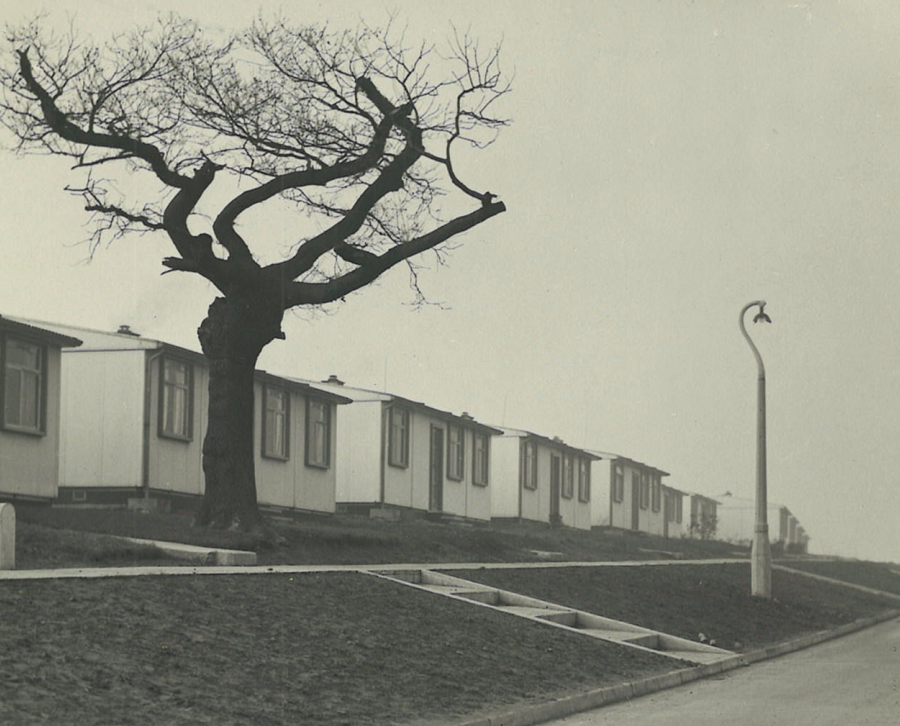 Photographic image of a street of post war prefab housing taken in 1950